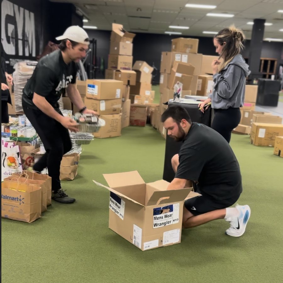 Volunteers packing Thanksgiving boxes at THE GYM